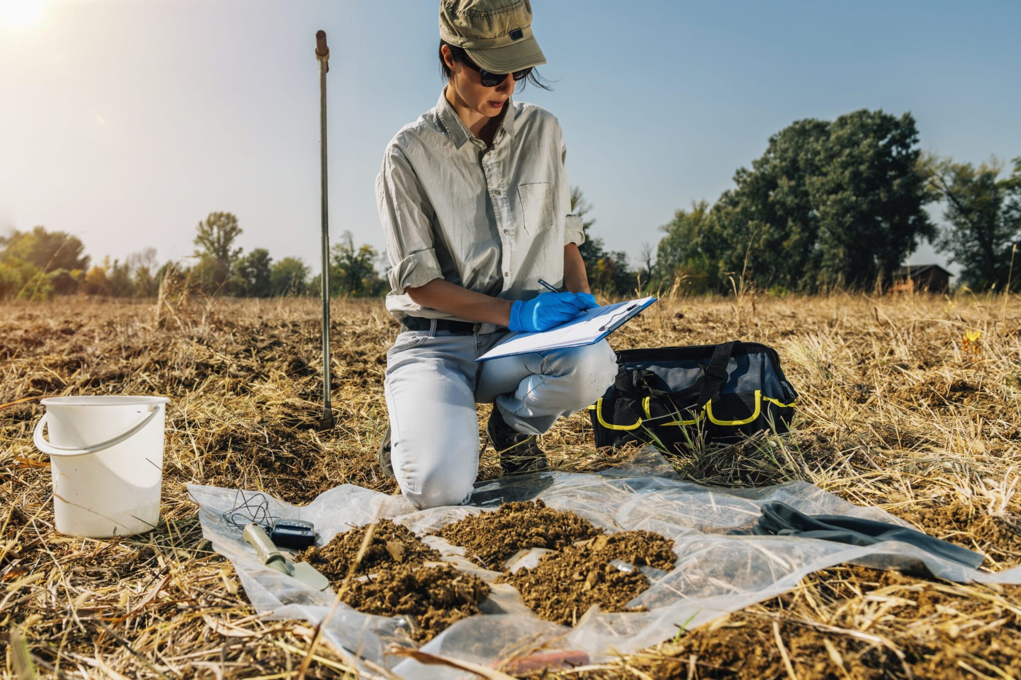 An agronomist testing soil.
