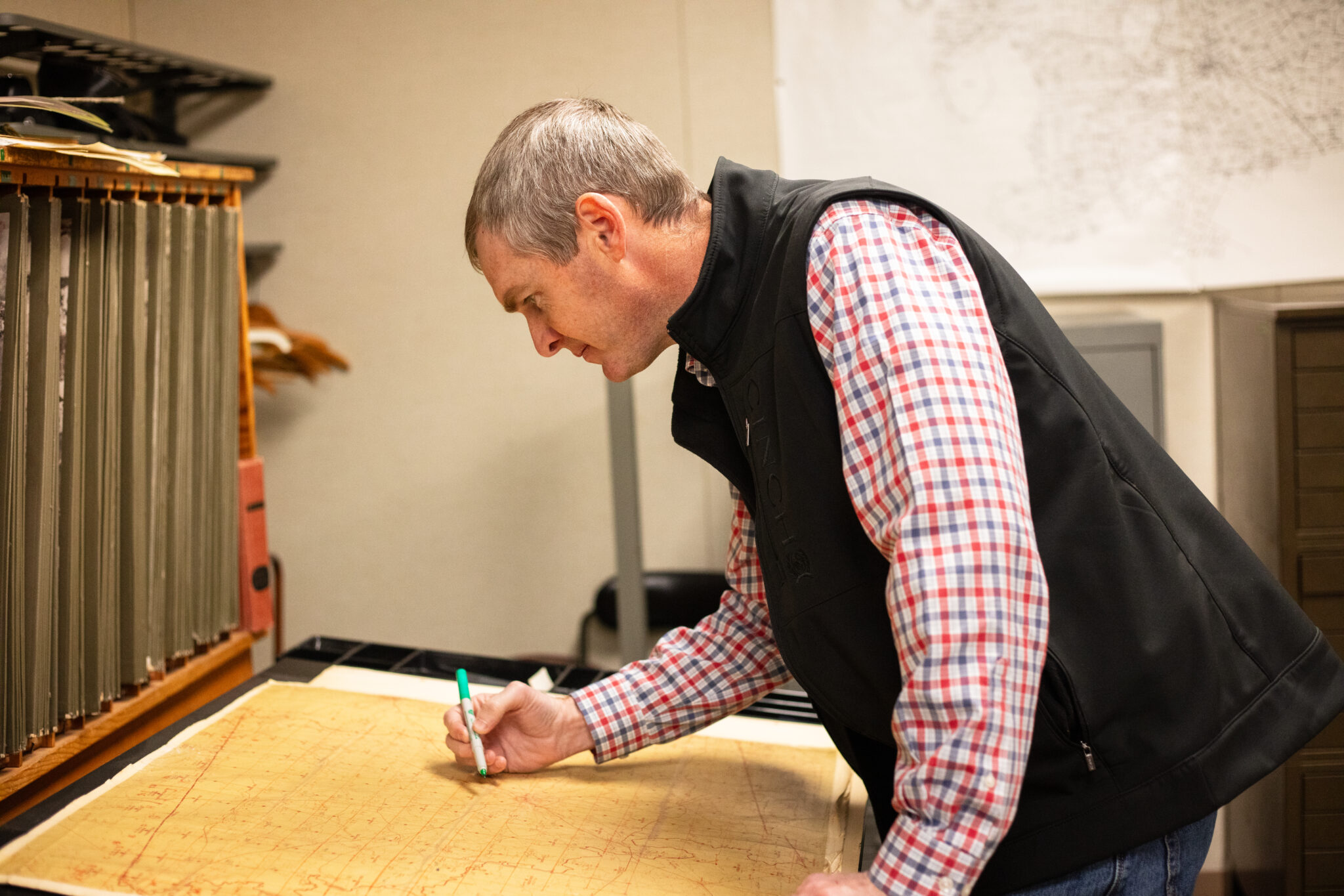 Brandon reviewing a map.