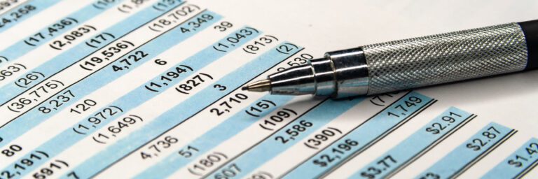 A financial statement and ball-point pen.