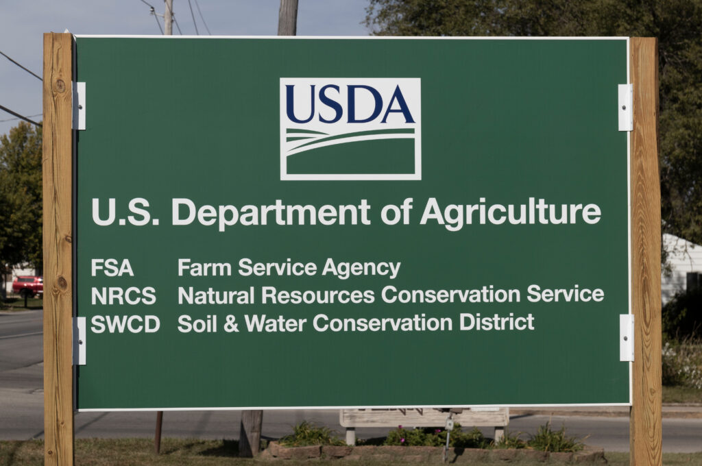 A green sign with the USDA logo. It has the following words: U.S Department of Agriculture, FSA (Farm Service Agency), NRSC (Natural Resources Conservation Service), and SWCD (Soil & Water Conservation District)