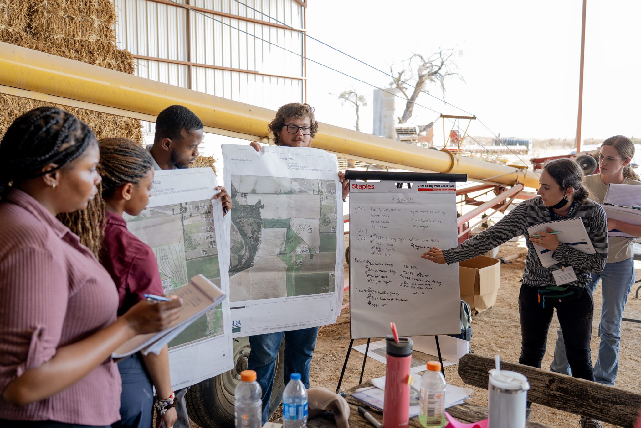 a group of people in a conservation planner training